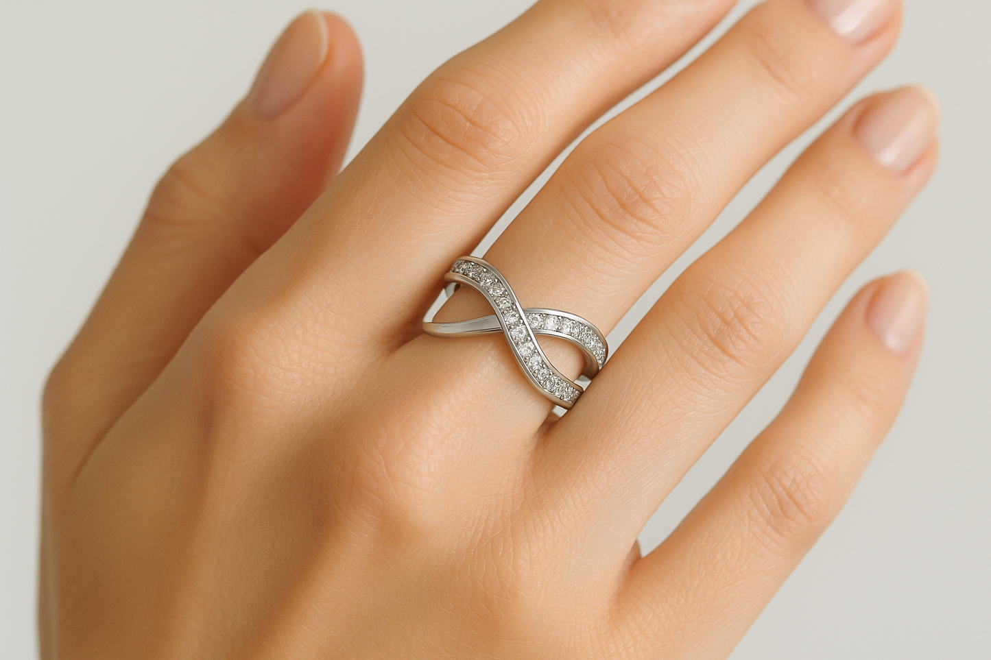 Professional lifestyle photography of a white female model wearing the silver infinite link ring