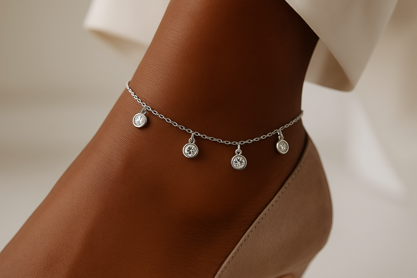 Professional lifestyle photography of an African American female model wearing the silver crystal charm anklet