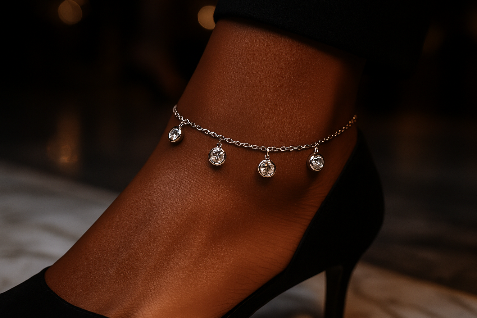 Glamorous lifestyle shot of an African American model wearing the silver crystal charm anklet