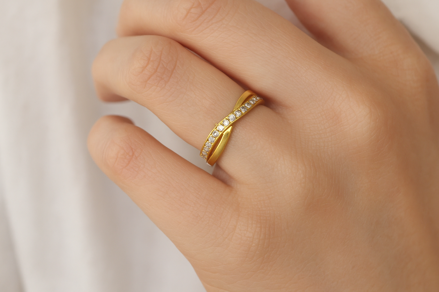Lifestyle shot of a white model wearing both rings stacked together