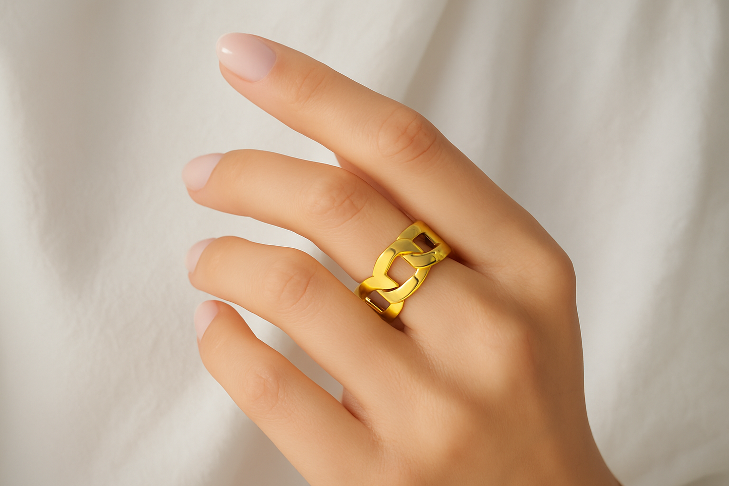 Professional lifestyle photography of a white female model wearing the gold chain link ring