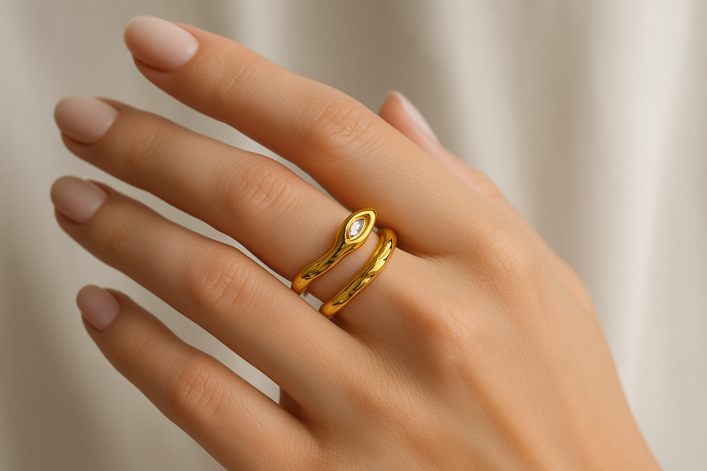 Professional lifestyle photography of a white female model wearing the gold serpent ring
