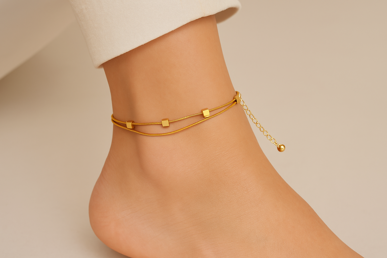 Professional lifestyle photography of a white female model wearing the golden aura anklet